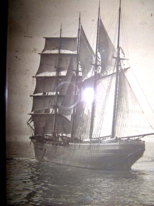 An original 19th century photograph of a four-masted ship under full sail circa 1880